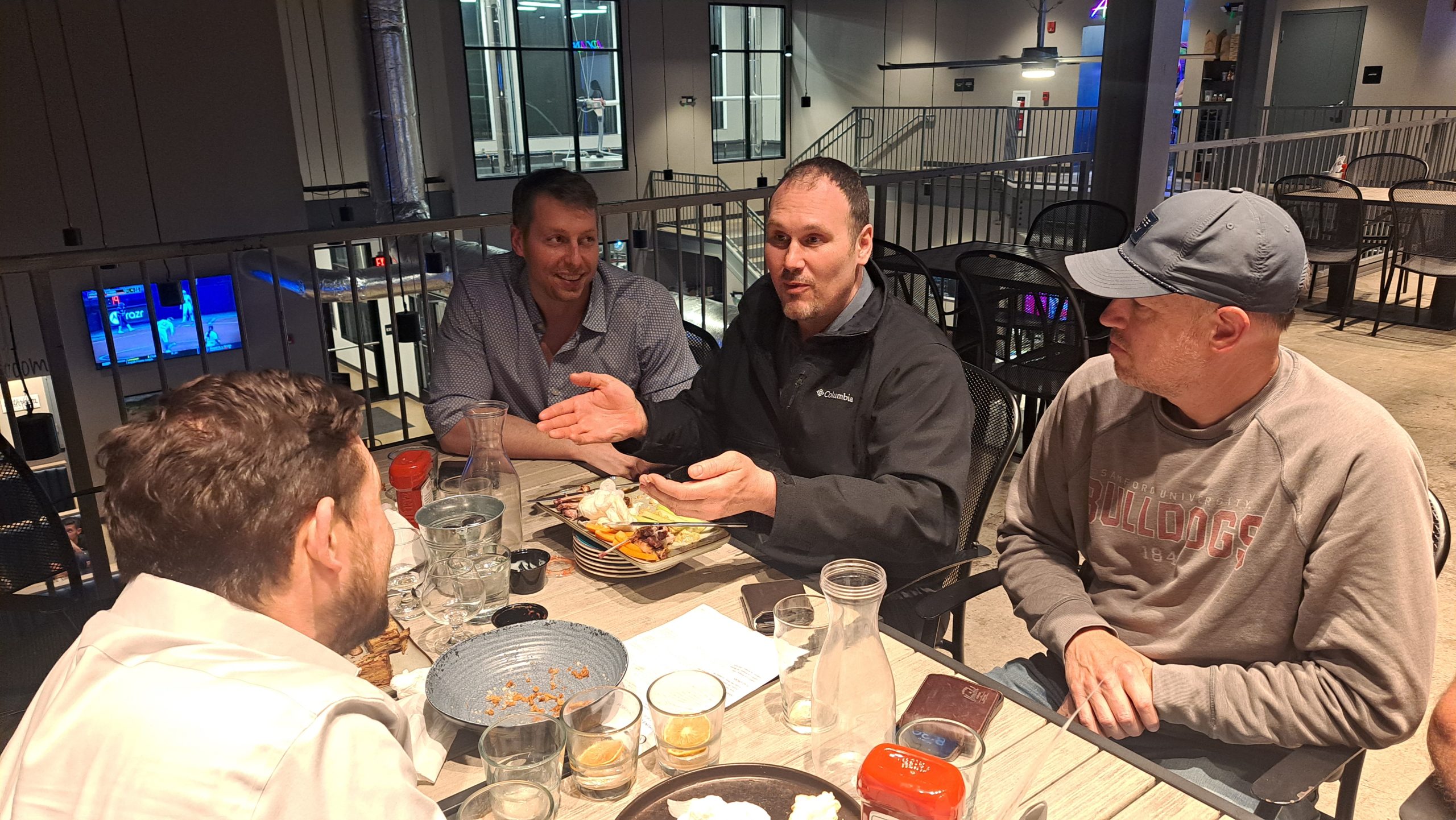 chiropractors sitting in a restaurant after the showcase